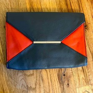 Grey and orange clutch